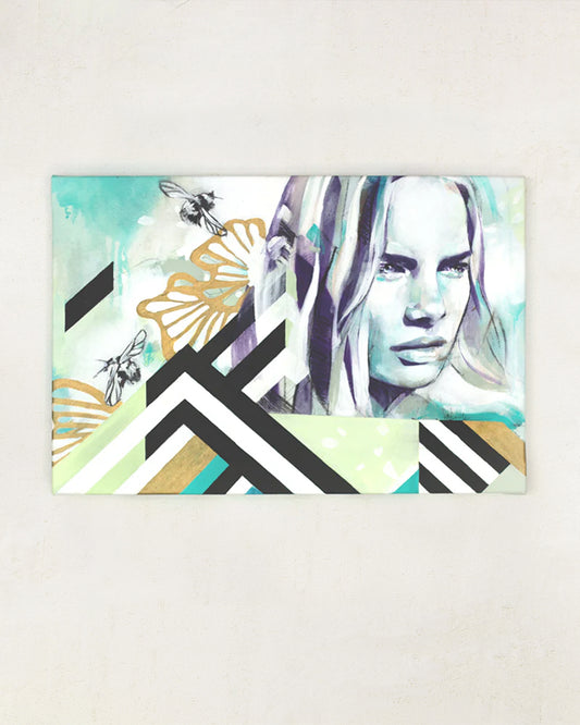 Geometric shapes and bohemian woman portrait painting in turquoise hanging on a white wall.