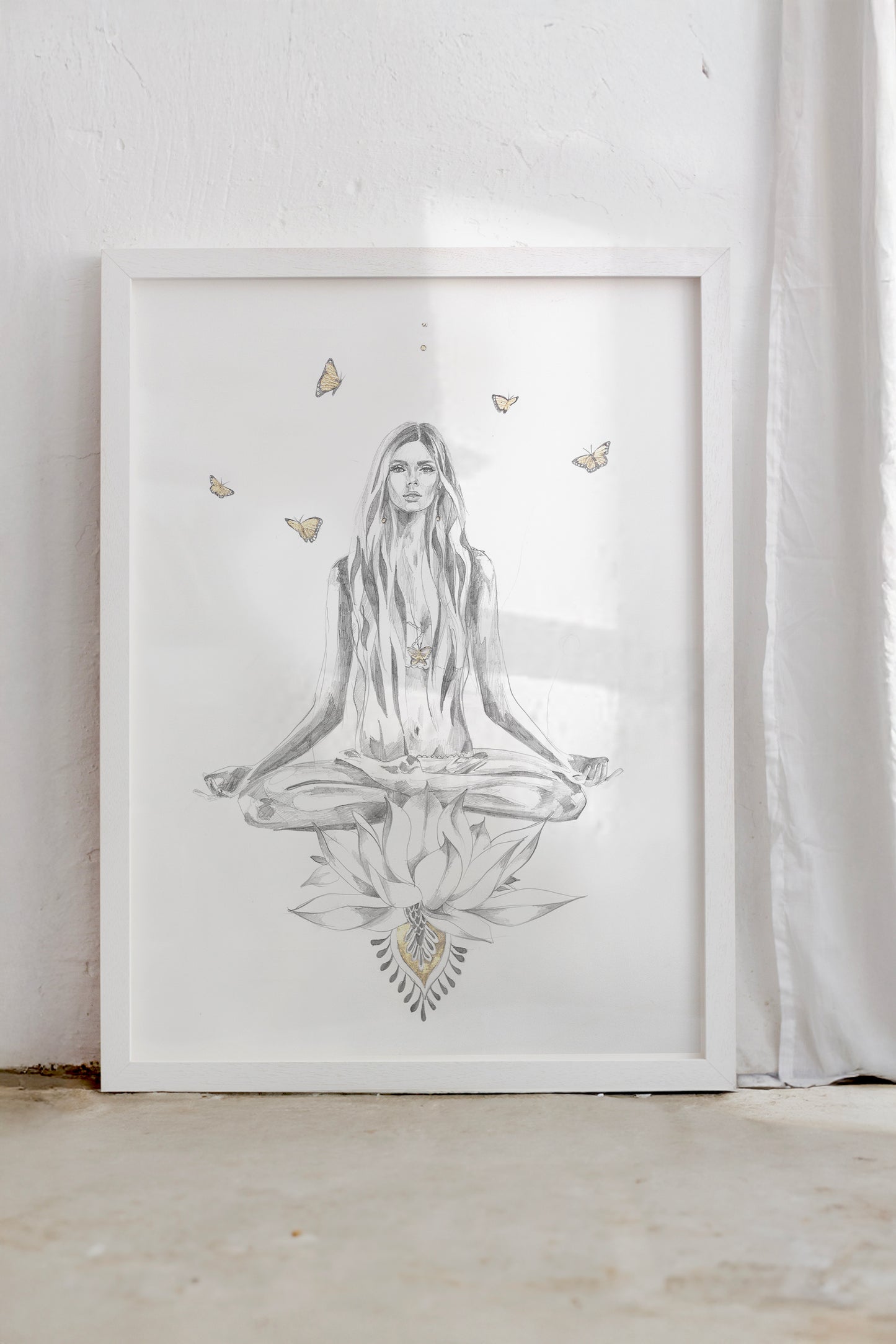 In a white frame a yoga girl sits in lotus pose meditation. She sits on a lotus flower as butterflies drift around her.