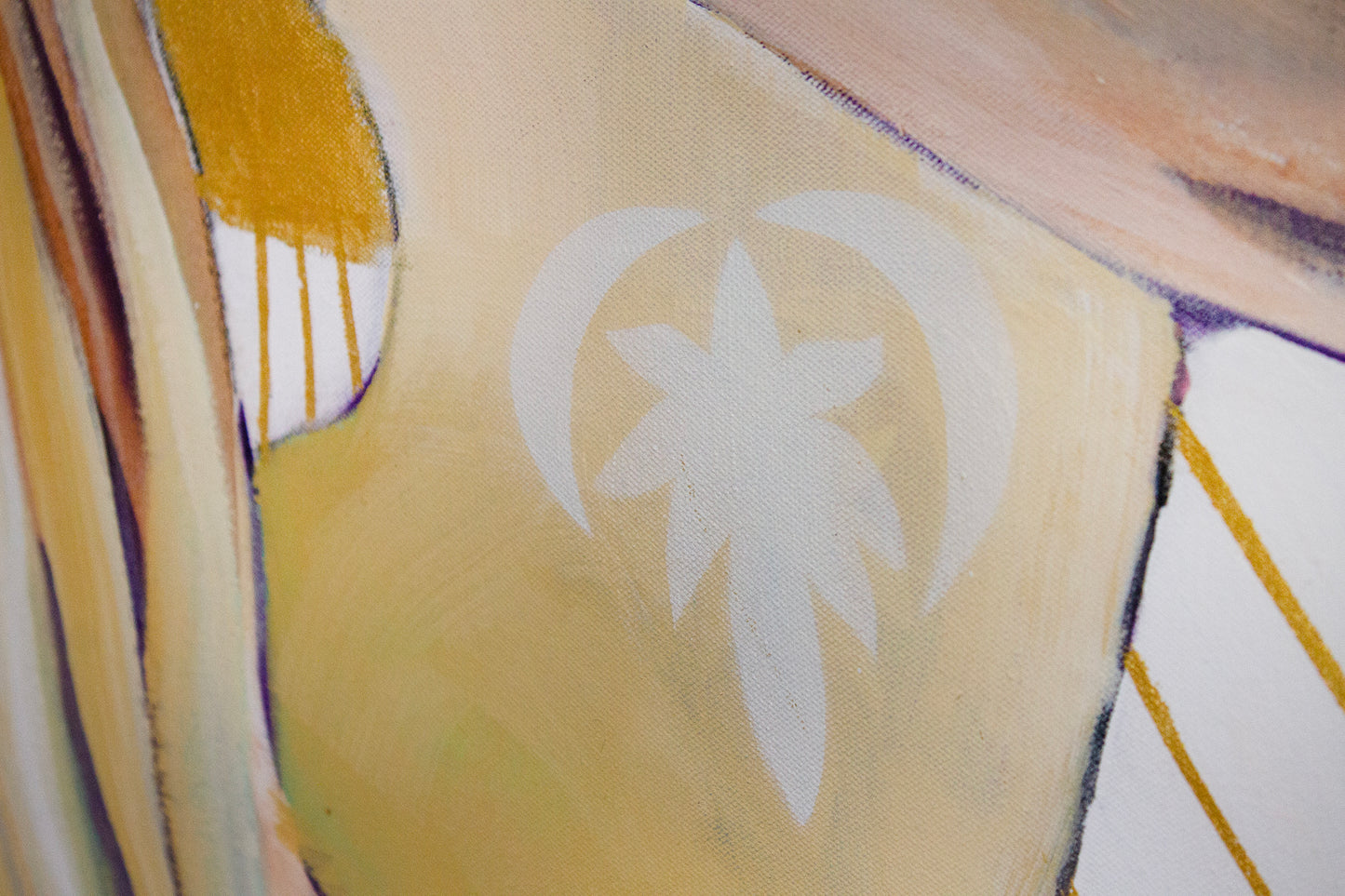 Close up detail of a lotus flower logo on the bodysuit of a woman practicing yoga.