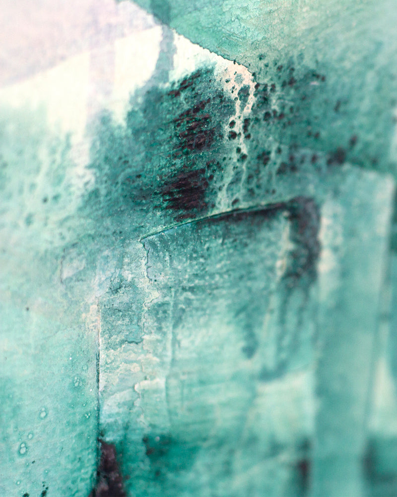 Close up detail of painting Reflect by Hannah Adamaszek. plaster texture and brush strokes on a turquoise green base.