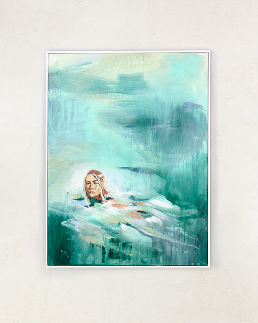 Painting of a woman swimming in turquoise seas. Drips and brushstrokes can be seen. White frame on a white wall.