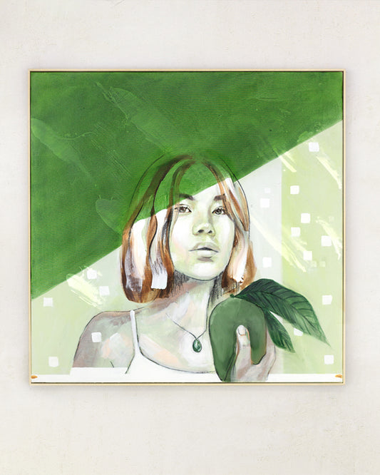 Green shadow over asian woman's face. Holding fit and at one with nature. In a wooden frame on a white wall.