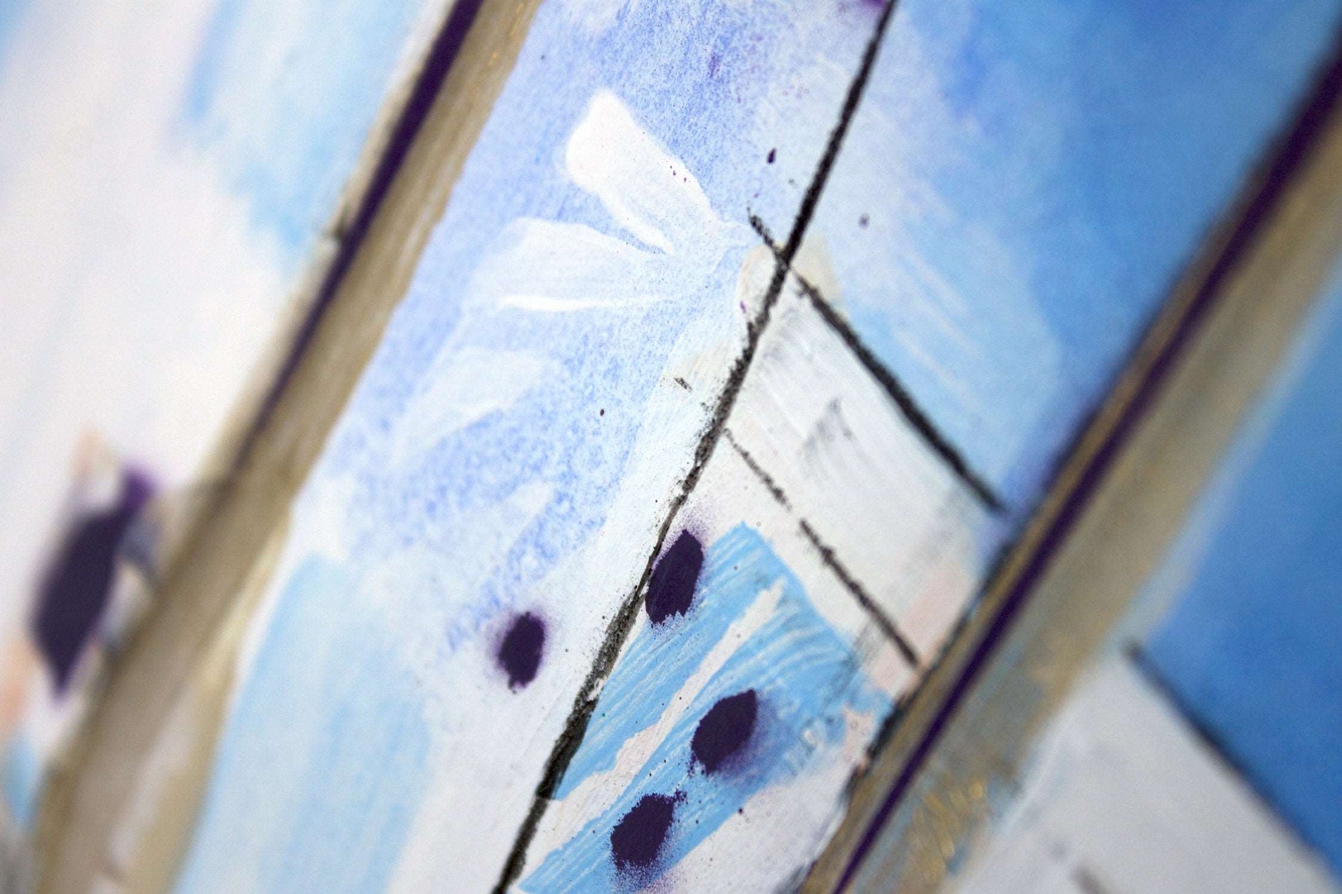 Close up detail of painting in white and blue with viable brush strokes.