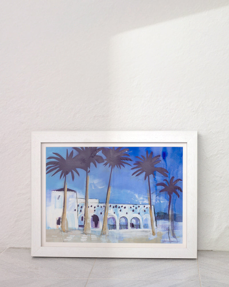 Palm trees and white washed walls of Nerja, Spain. In a white frame in a Mediterranean home.