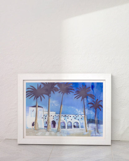 Palm trees and white washed walls of Nerja, Spain. In a white frame in a Mediterranean home.