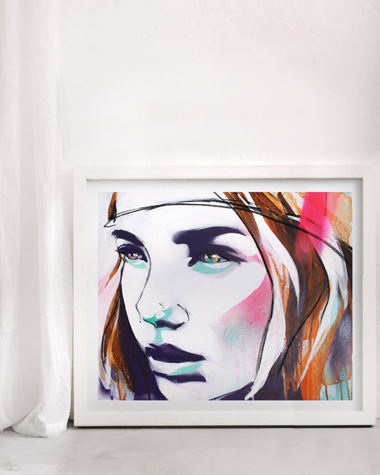 Neon portrait print of a woman in a street  art style. In a white frame on a white wall