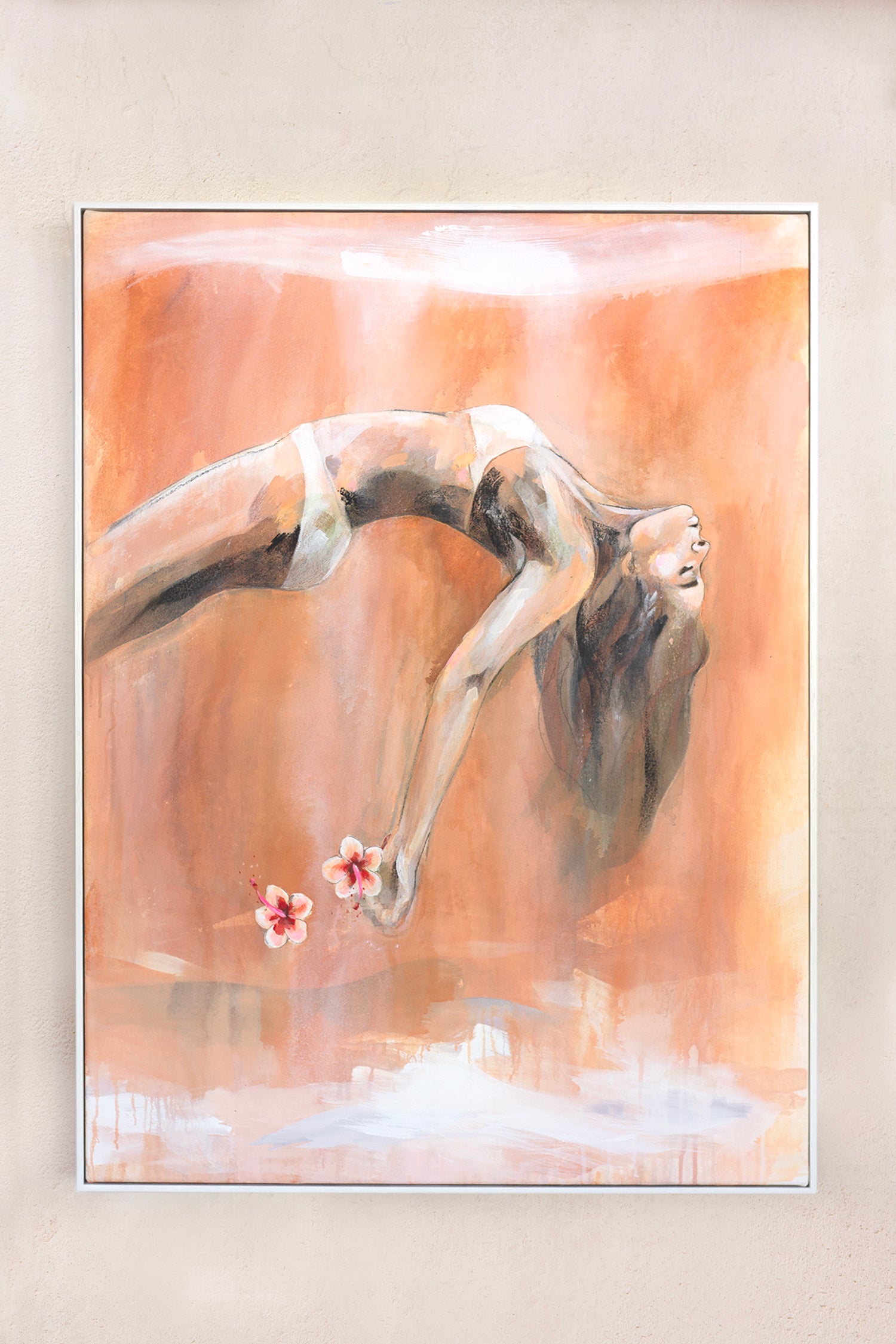 This is a painting of a woman in a graceful backbend, wearing minimal clothing, with her long hair flowing downward. She holds two delicate flowers in her hands, which appear to be floating. The artwork features warm, earthy tones of orange and beige, with soft brushstrokes and watercolor-like textures. The overall style is expressive and fluid, giving a sense of movement and serenity.