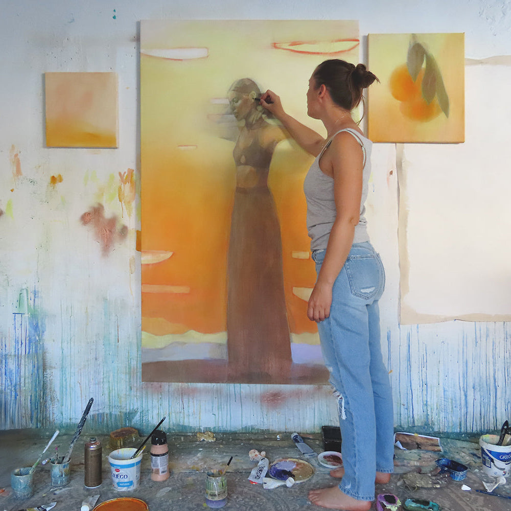 Hannah Adamaszek painting on her studio in Granada Spain.