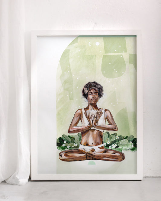Art print framed in white of a meditating African woman with a flower in her hands surrounded by green gardens.