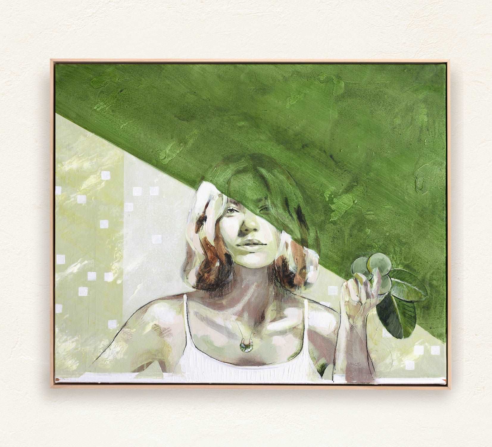 Painting Nourish by Hannah adamaszek of a bohemian woman in green at one with nature. Framed in a natural wood frame in a mediterranean home.