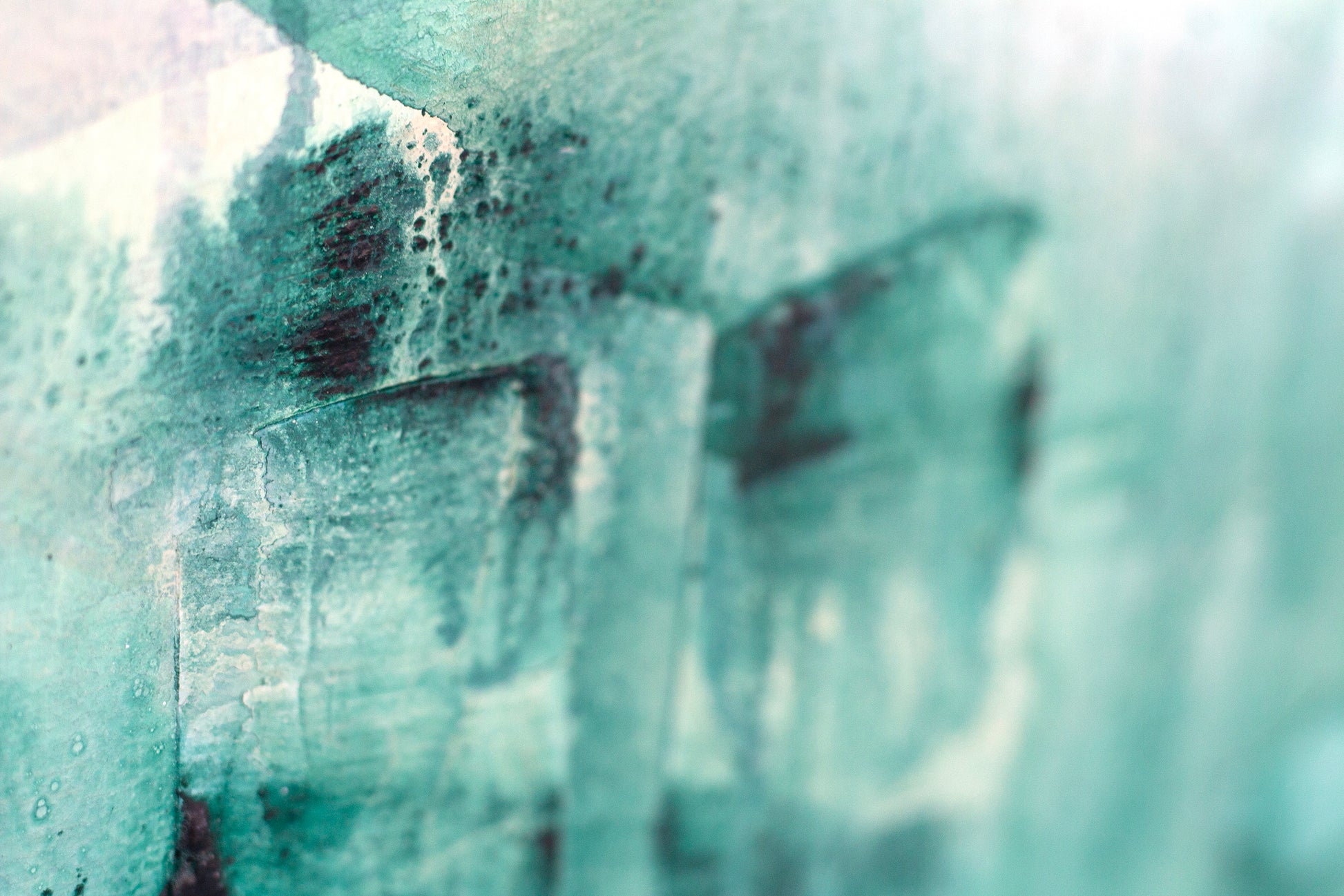 Close up detail of painting Reflect by Hannah Adamaszek. plaster texture and brush strokes on a turquoise green base.