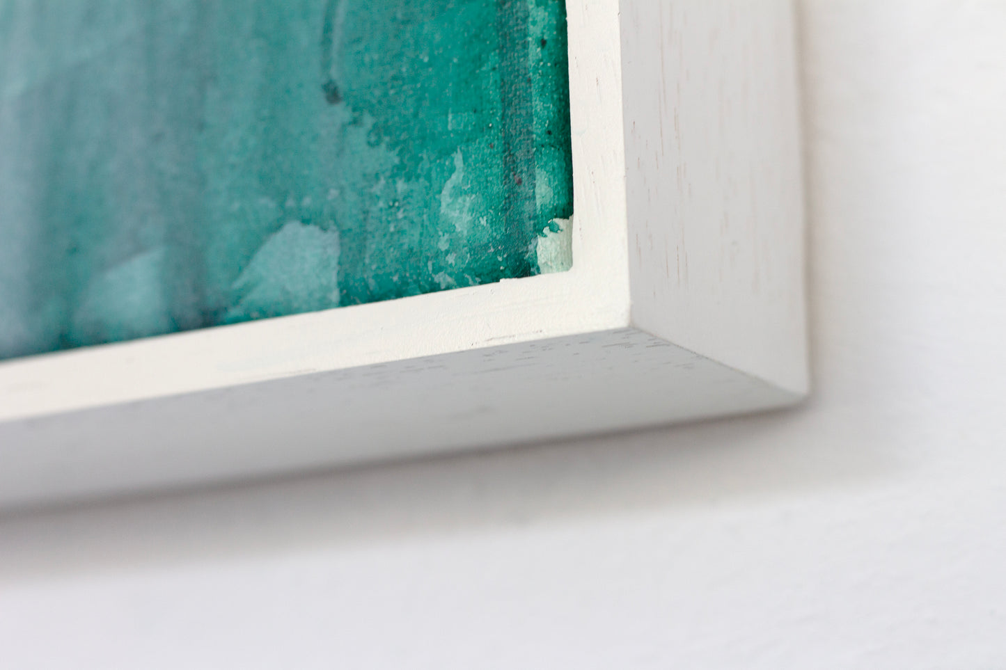 Close up detail of the white tray frame for painting Reflect by Hannah Adamaszek.