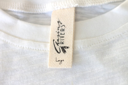 Close-up of the Chasing Rivers clothing label on an organic cotton t-shirt from the Studio Hannah Chloe collaboration.