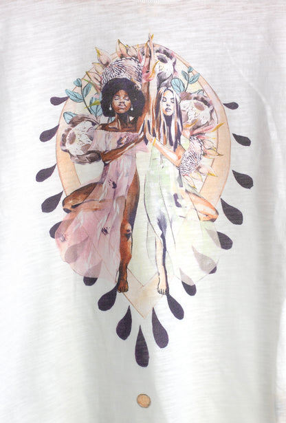 Close-up of the Grounded t-shirt artwork by Studio Hannah Chloe, featuring two women in yoga tree pose surrounded by floral and earth-inspired details.