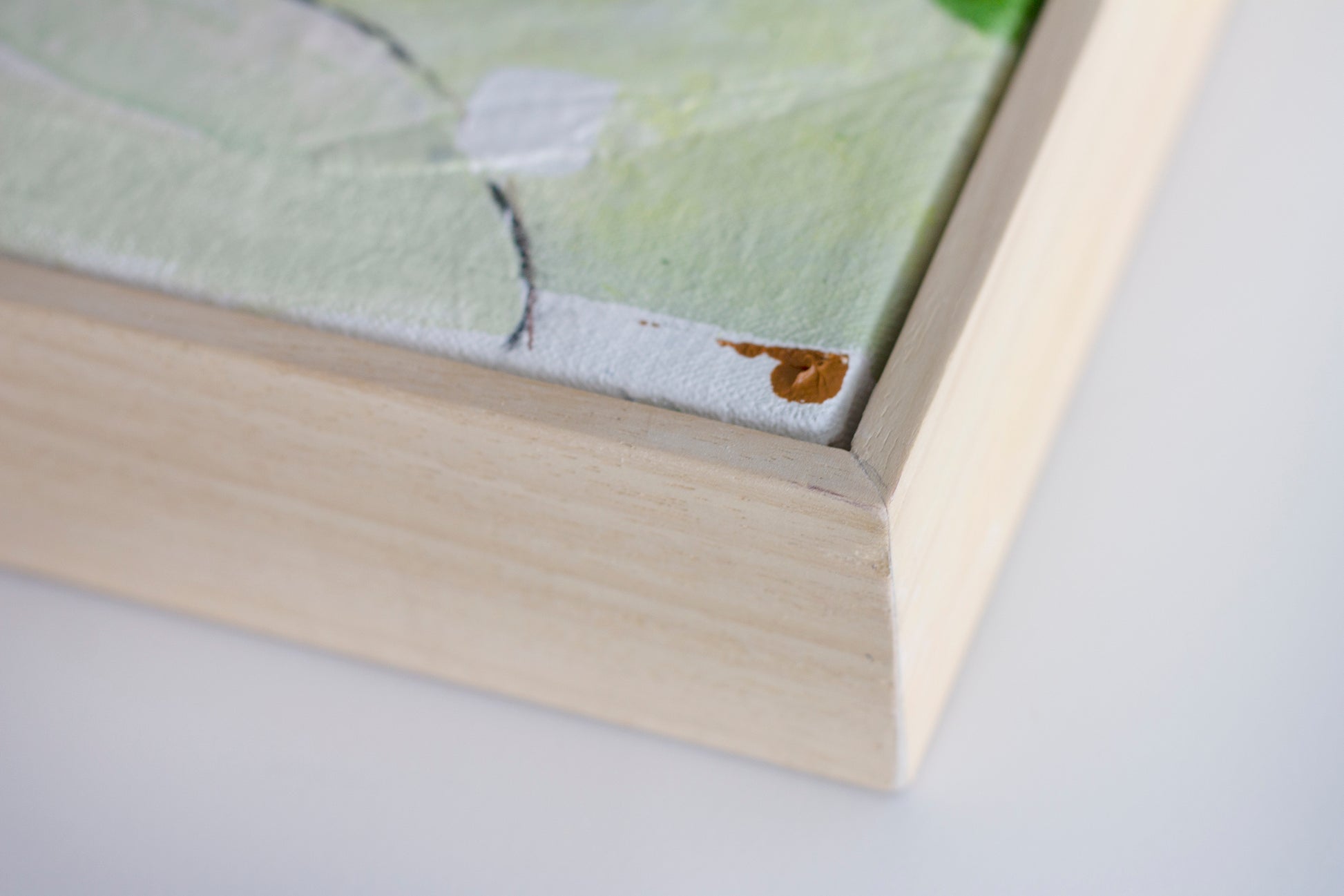 Close up detail of the natural wood tray frame on painting Balm by Hannah Adamszek
