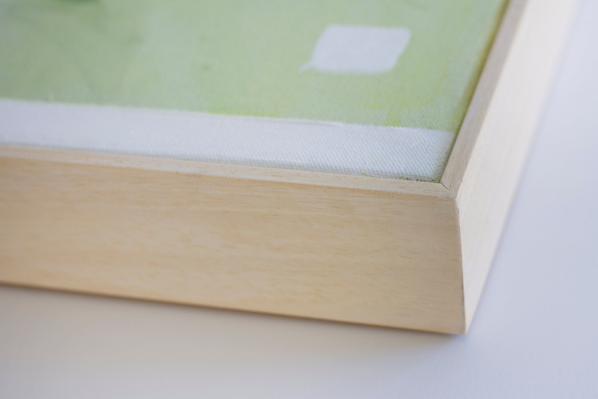 Close up detail of the natural wooden tray frame of painting Soothe by Hannah Adamaszek.